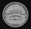 custom pewter coin - Hermann Fire Dept 150th ann - back view